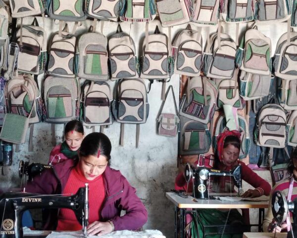 3 Young Women are engaging in bags sewing.